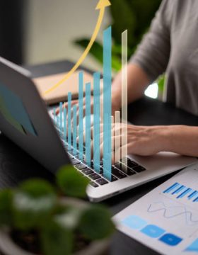 Close up shot of females hands typing message for plan business growth on laptop at home office.